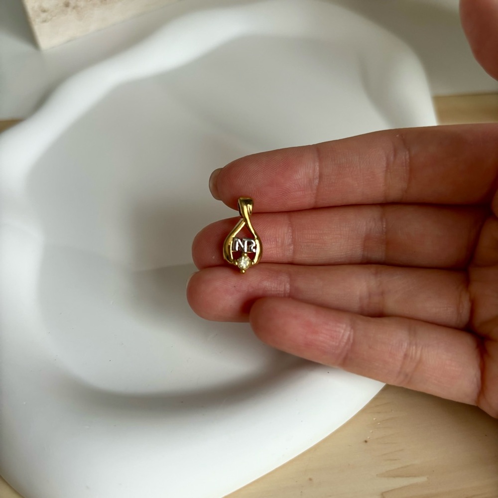 Authentic vintage Nina Ricci gold tone pendant